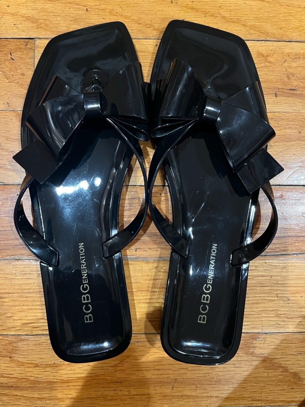 BCBGeneration Glossy Black Bow Slide Sandals